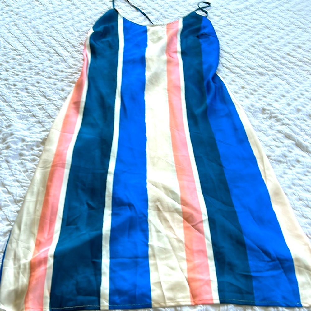 Flowy summer dress with spaghetti straps and cute tie back.